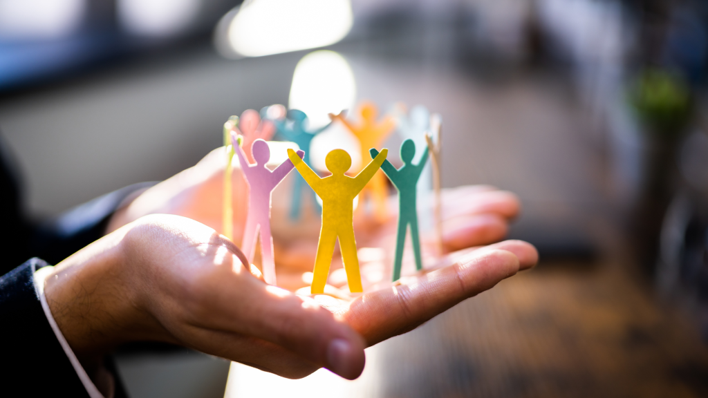 Paper people holding hands