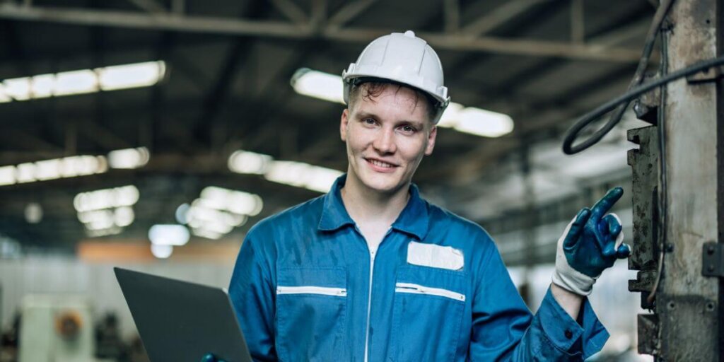 construction man with computer on a site