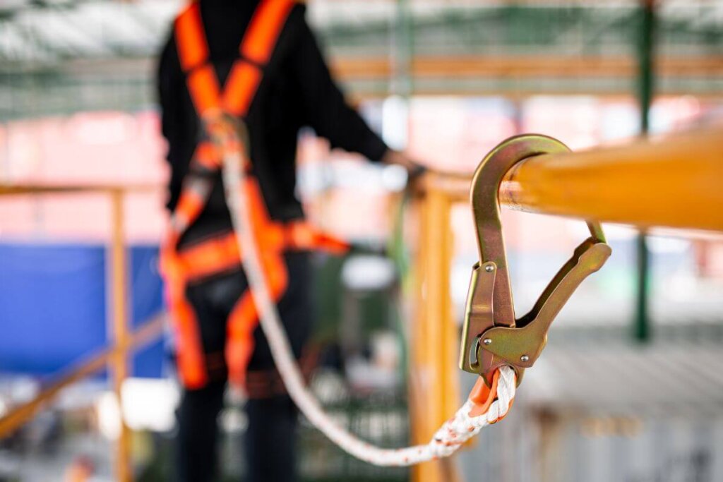 Construction worker wearing safety harness