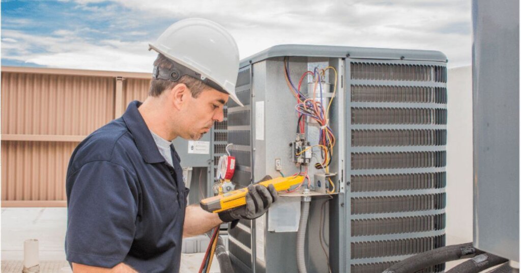 hvac worker checking monitor