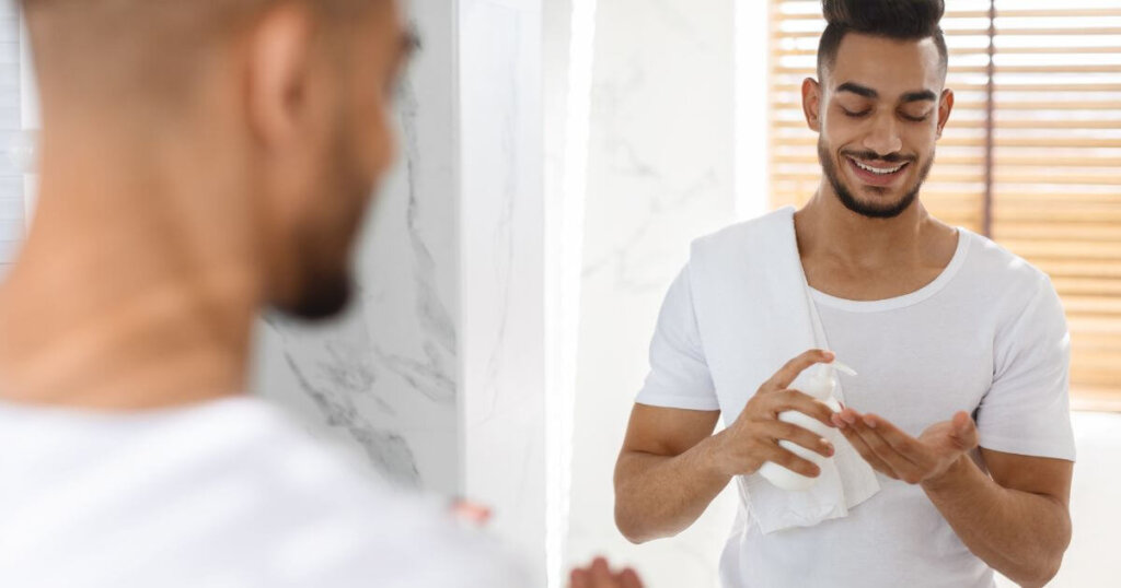 man putting on magnesium lotion
