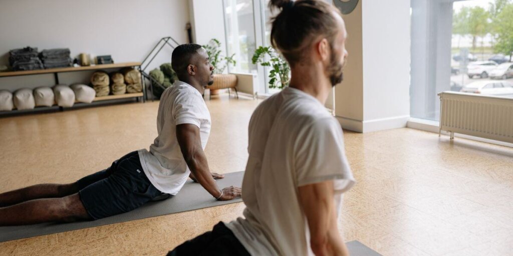 Men doing yoga in a studio