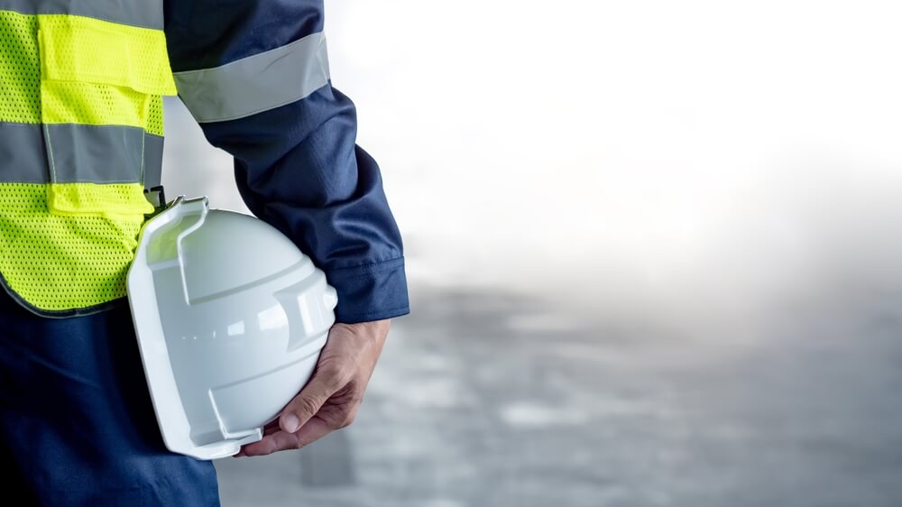 construction worker with a safety vest and hard hat