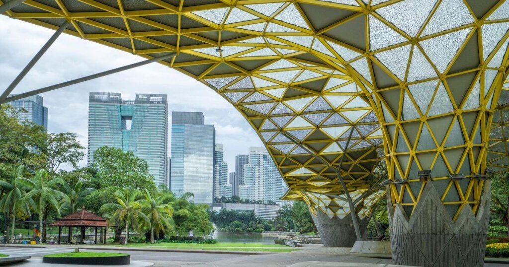 green building with city in background