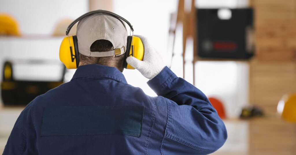 Worker wearing hearing protection