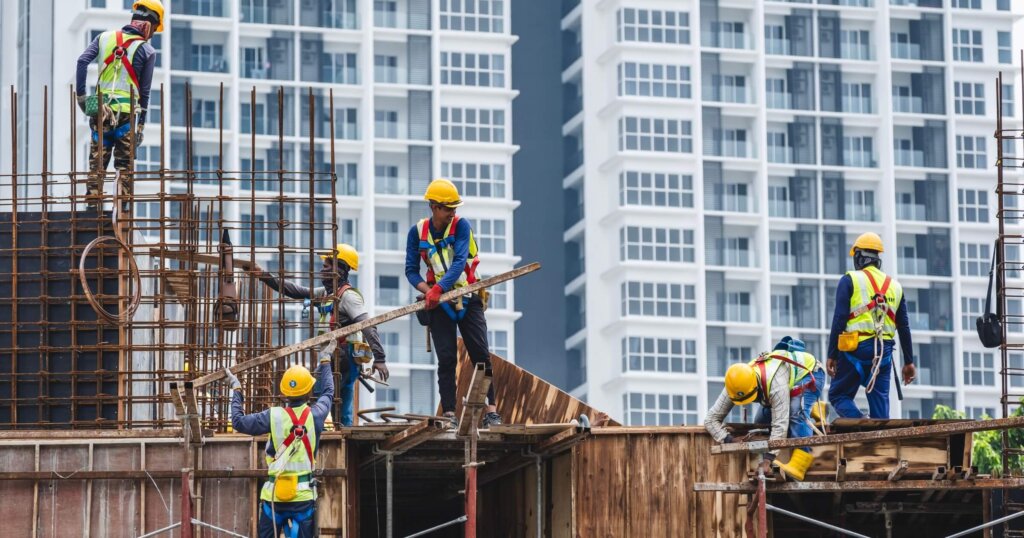 immigrant construction workers on a site