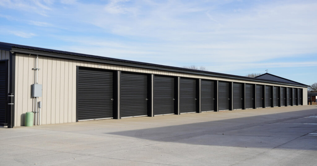 Black and tan storage unit buildings.