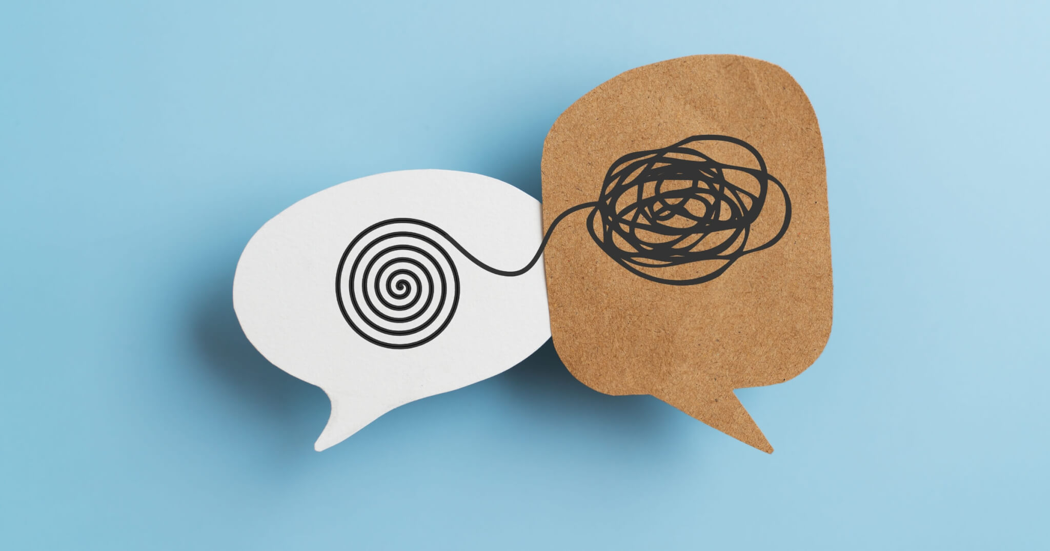 Mental health, brain disorder, World mental health day, Alzheimer, Psychology concept. Tangle of thoughts and clear line on real brown and white speech bubble paper cut with blue background