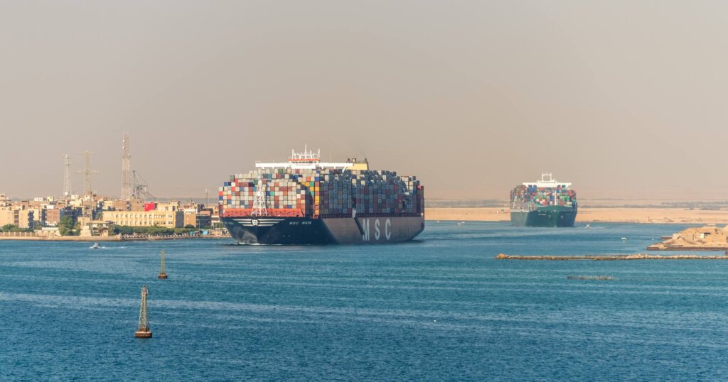 Suez, Egypt - November 5, 2017: Large container vessels (ships) passing Suez Canal at Egypt, Africa on the southern end of the Suez Canal and exiting into the Gulf of Suez.