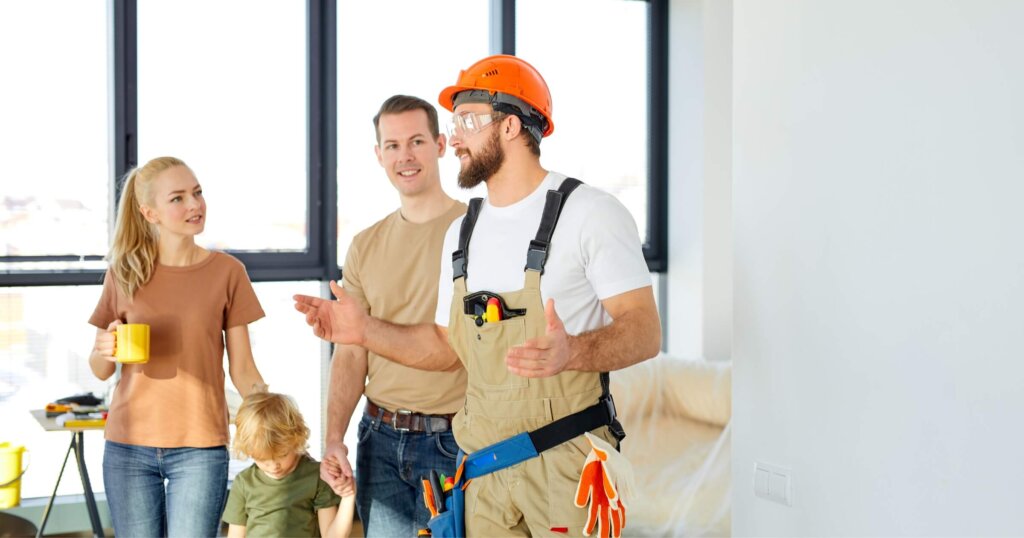 Builder repairman explaining future house design plans to family with child. Meeting at home to talk about house appearance, interior decoration and home layout.