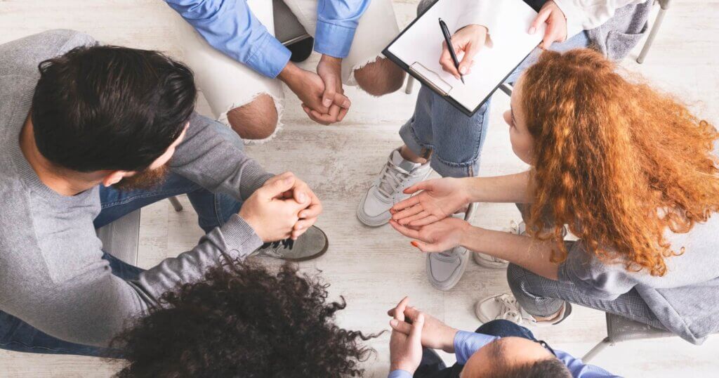 Discussion Group Concept. Diverse people discussing their problems with others seated in circle, top view.