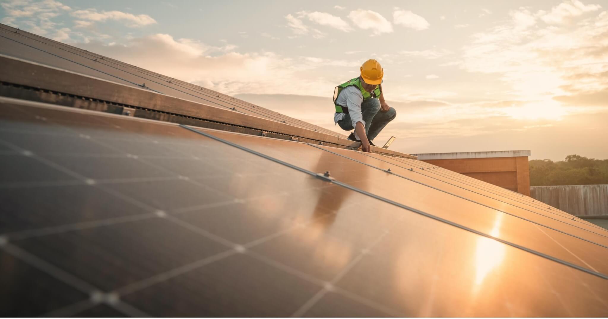 Service engineer checking solar cell on the roof for maintenance if there is a damaged part. Engineer worker install solar panel. Clean energy concept.