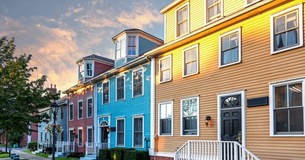 The sun sets on a row of the colorful Victorian clapboard houses in Charlottetown, capital of Prince Edward Island, Canada.