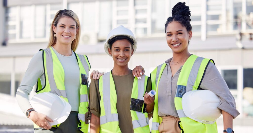 Architecture, women construction team and diversity in portrait, contractor group with smile at building site. Architect, engineering female with solidarity and trust in collaboration with builder