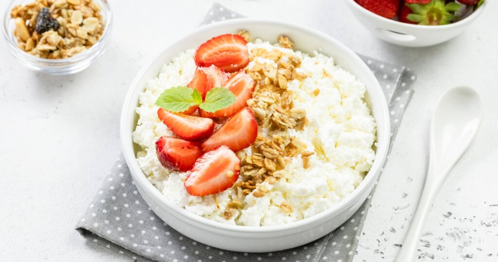 Cottage cheese with strawberries and granola.