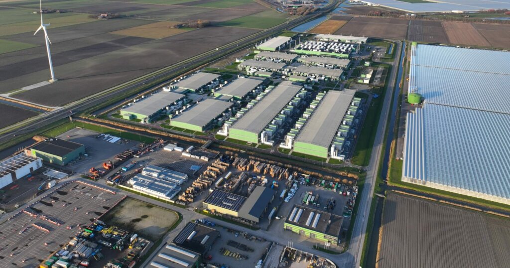 Large scale computing infrastructure, datacenter aerial drone overhead view. Telecommunication server infrastructure.