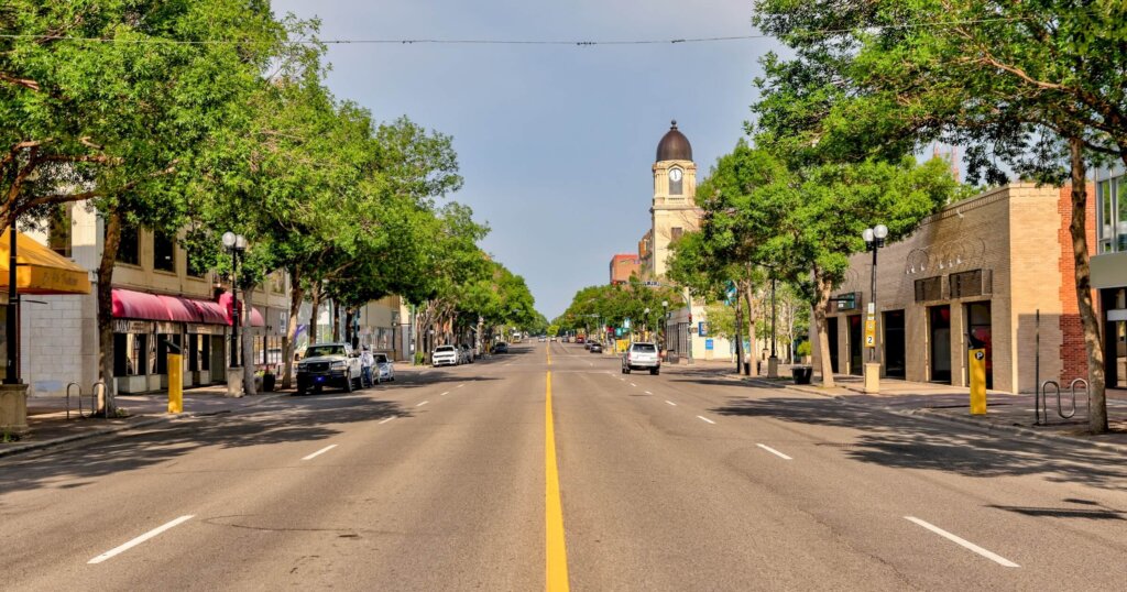 Lethbridge, Alberta - July 6, 2021: Looking down the middle of an empty street in Lethbridge Alberta