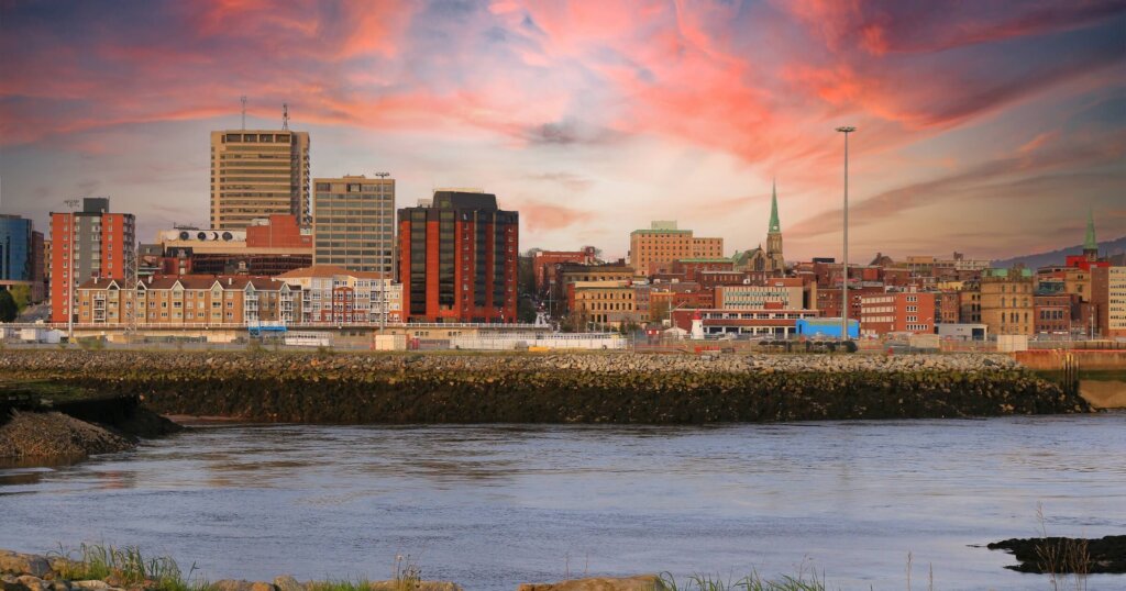 View of Saint John, New Brunswick, in the evening on the Bay of Fundy in the Maritime Provinces of Canada with beautiful colorful sunset.