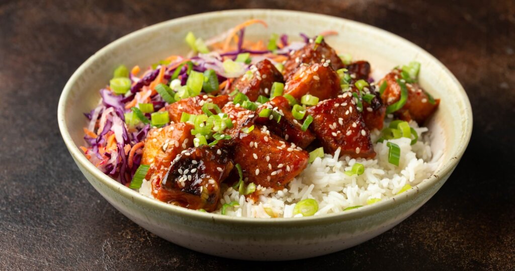 Vegan fried tempeh with rice and vegetables. Asian healthy food.