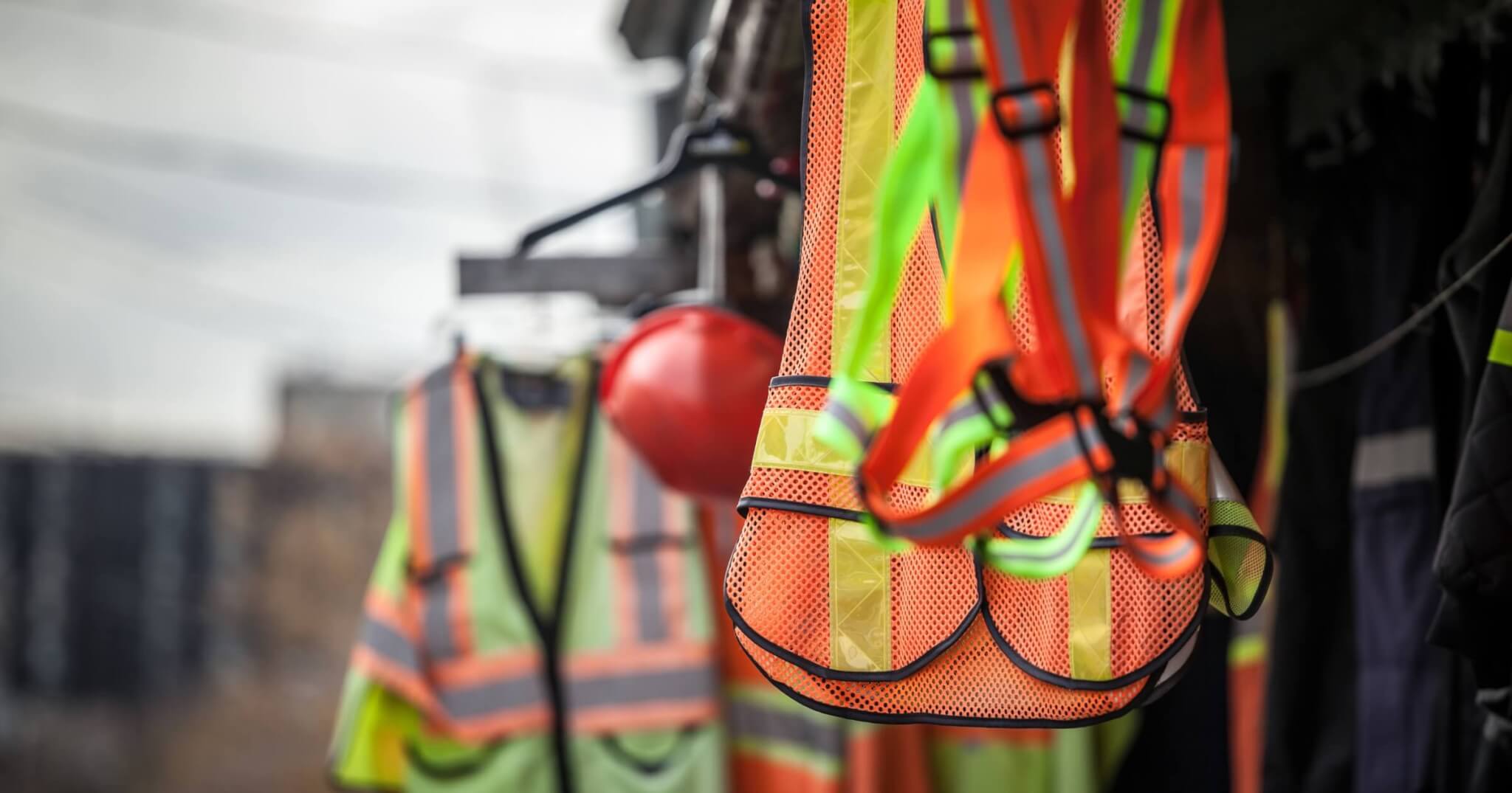 Personal protective equipments for sale on a shop: harness, reflective vests, yellow jackets, construction site helmets, as well as various other PPE devices