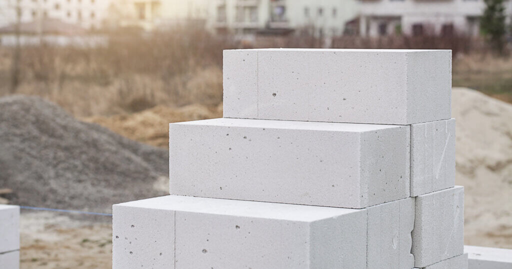 Aerated Concrete on house background. Unfinished house wall made from white aerated autoclaved concrete blocks