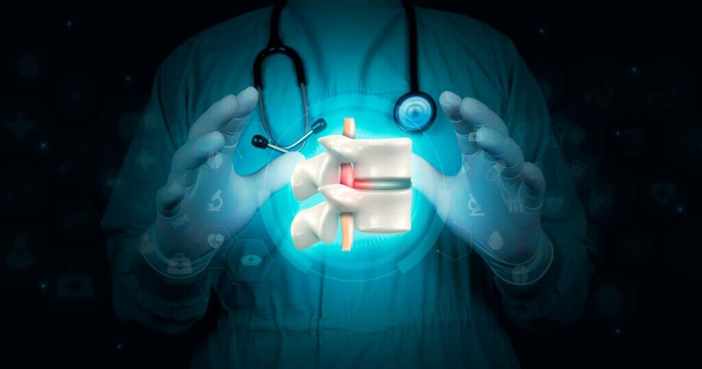 Spinal herniation, herniated disc. low back pain Spine. severe disc pain The hand holds the vertebrae on a dark background. Chiropractic. Doctor isolated on digital dark background.