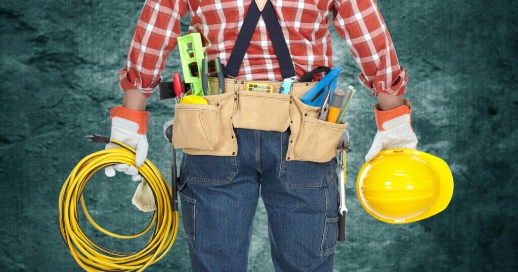 Electrician with helmet and cable.