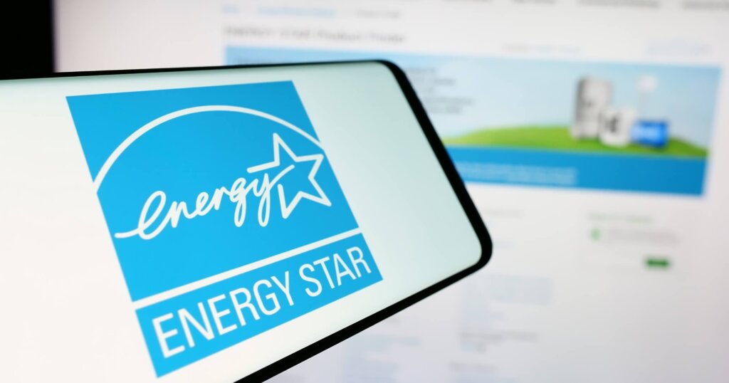 Cellphone with logo of American energy efficiency program Energy Star in front of website. 