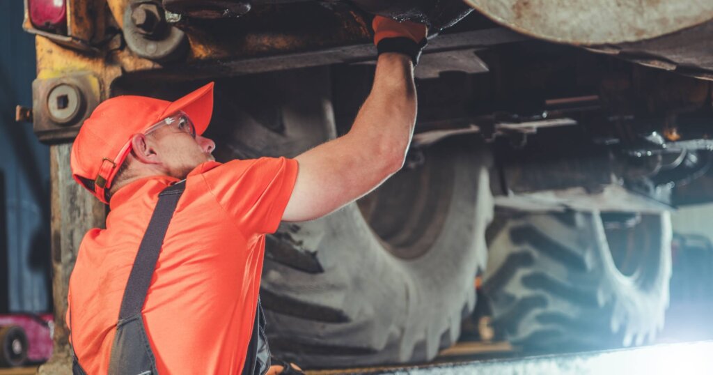 Heavy equipment mechanic working