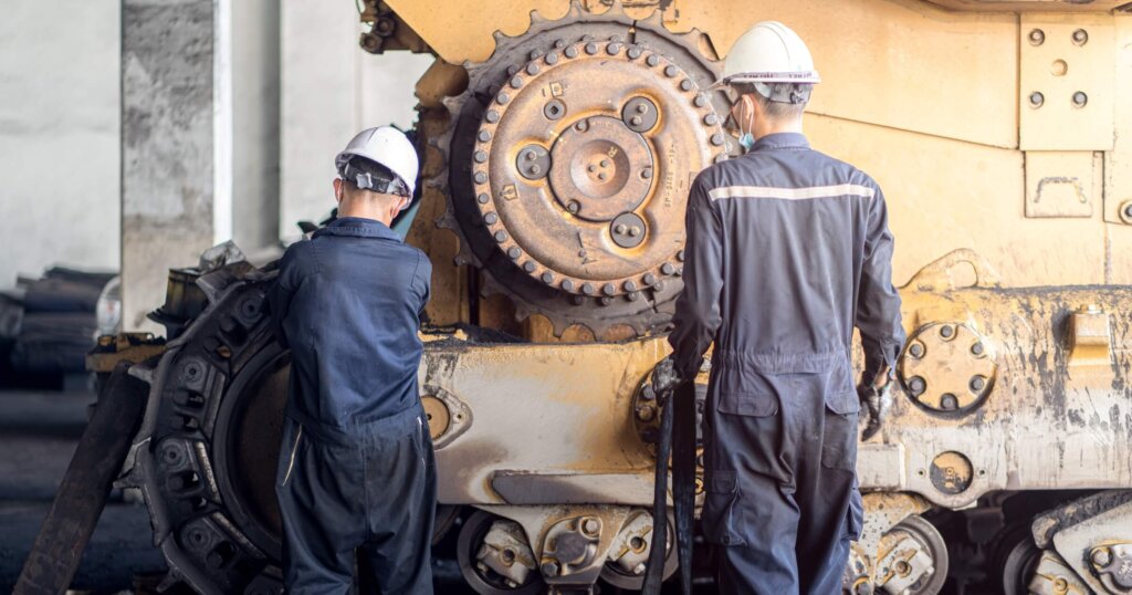 maintanance on a bulldozer by heavy equipment mechanics 