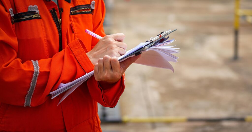 Action of a safety officer in full PPE coverall