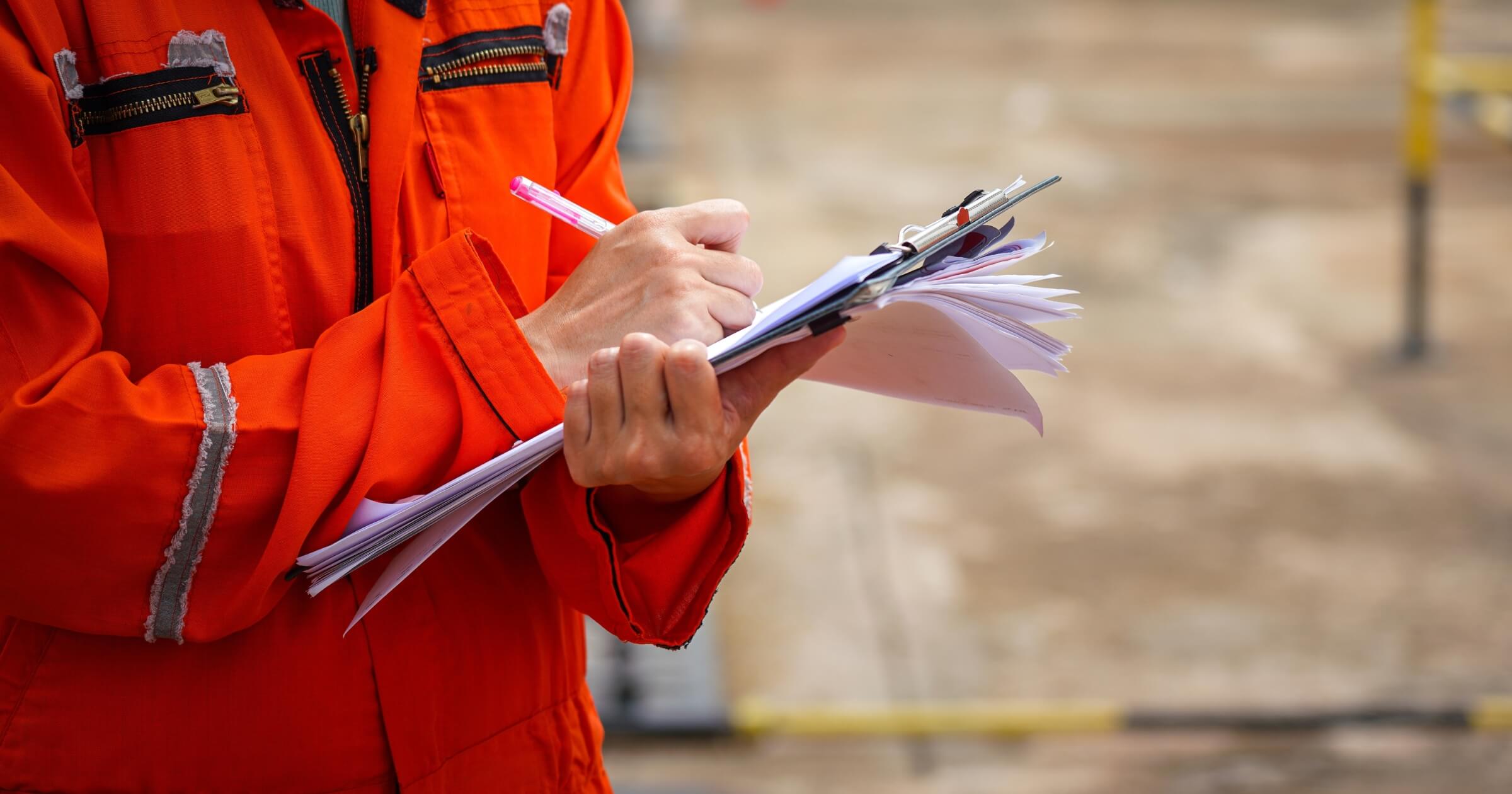 Action of a safety officer in full PPE coverall