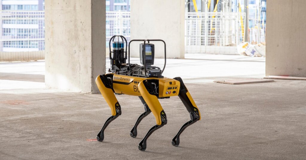 Spot robot by Boston Dynamics at a construction site reviewing progress.