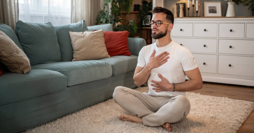 Man performing a breathing technique to calm anxiety