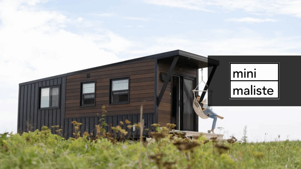 Tiny home builders Minimaliste Tiny Homes with dark panelled tiny home