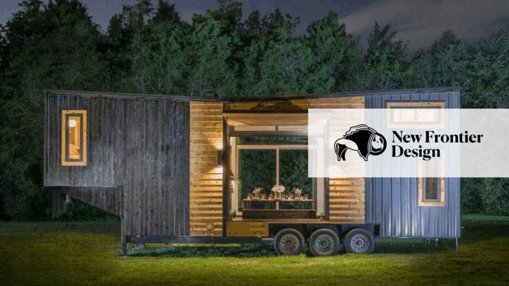 New Frontier Design wood and blue tiny home at night