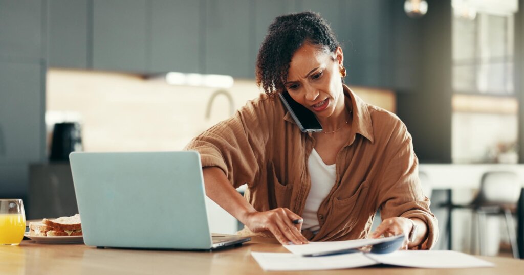 Woman, busy and phone call with paperwork for deadline