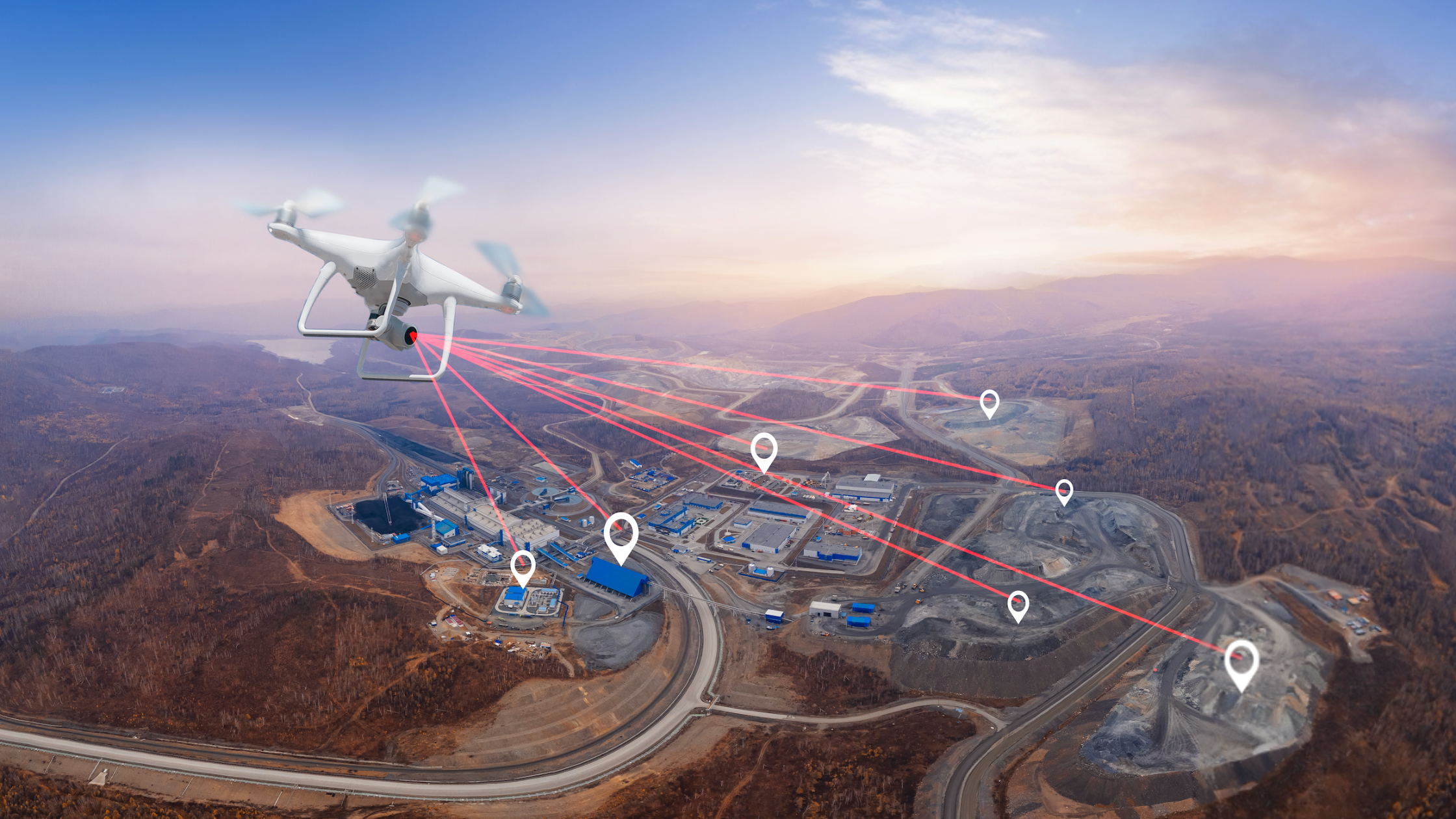 Drone surveying industrial site fromabove