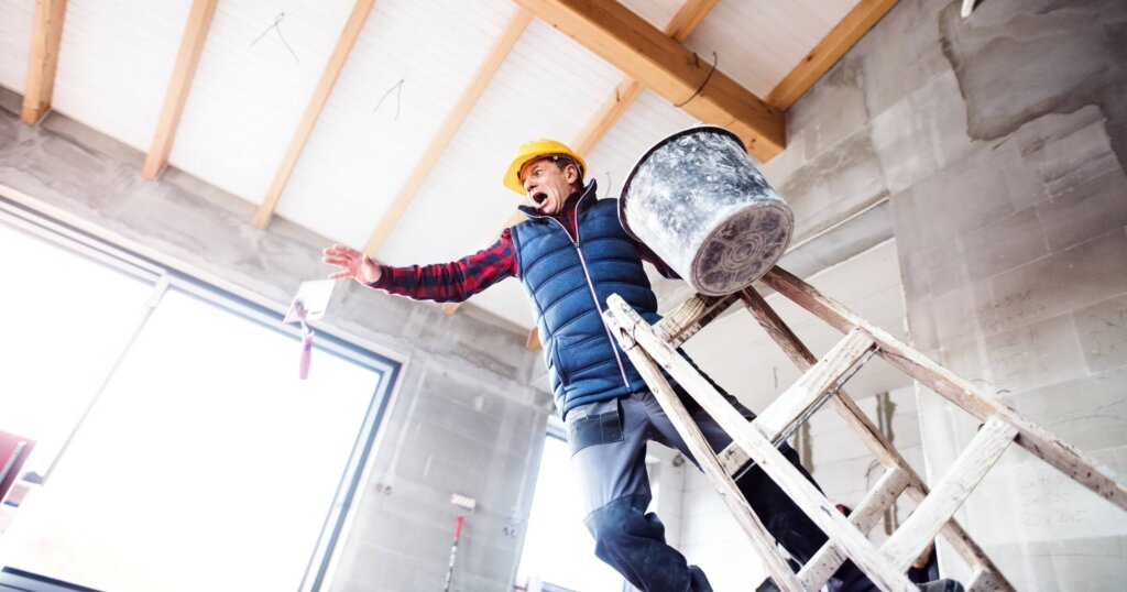 Man falling off the ladder.