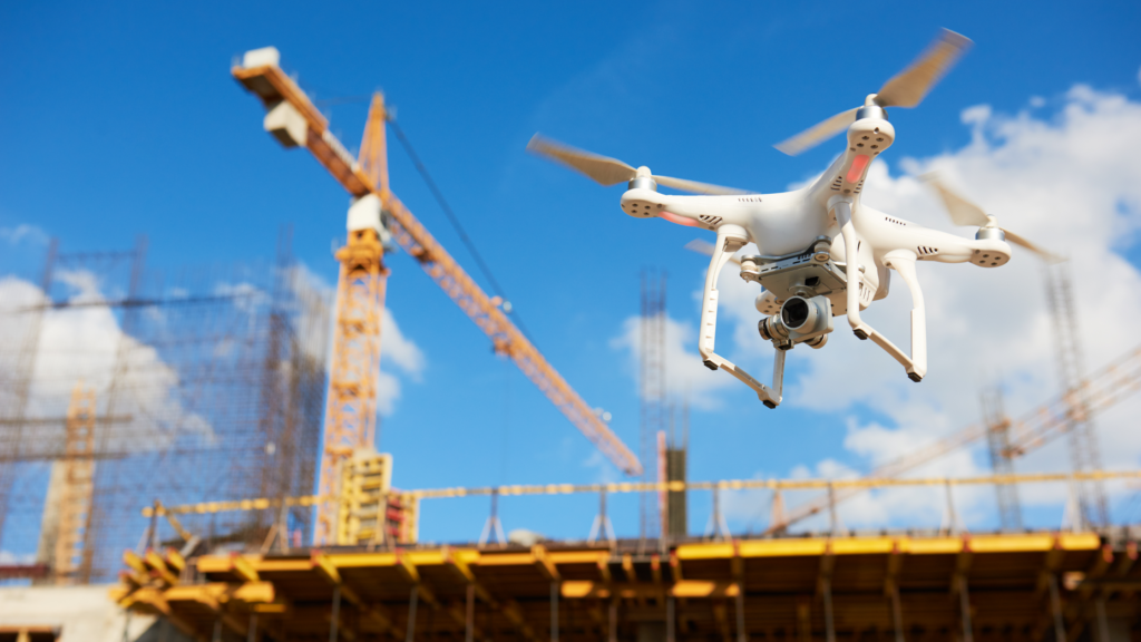 Field technology drone flying near construction site
