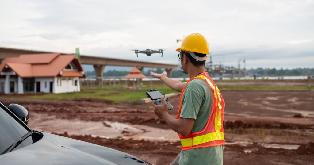 flying a dronedeploy drone over a construction site