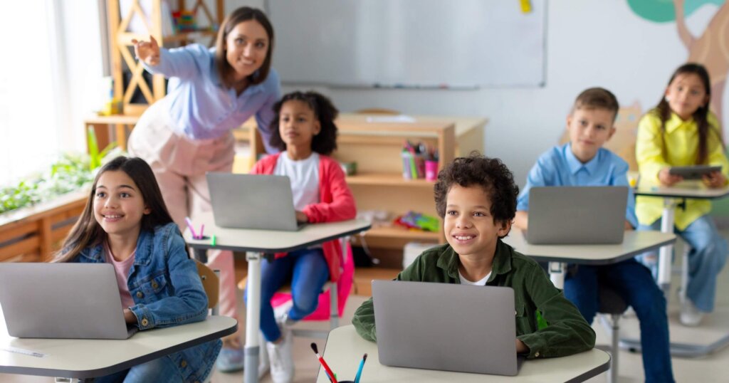 School children using laptops in developed high-income school
