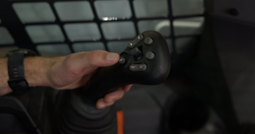 Voice command button to activate AI-powered Bobcat Jobsite Companion.