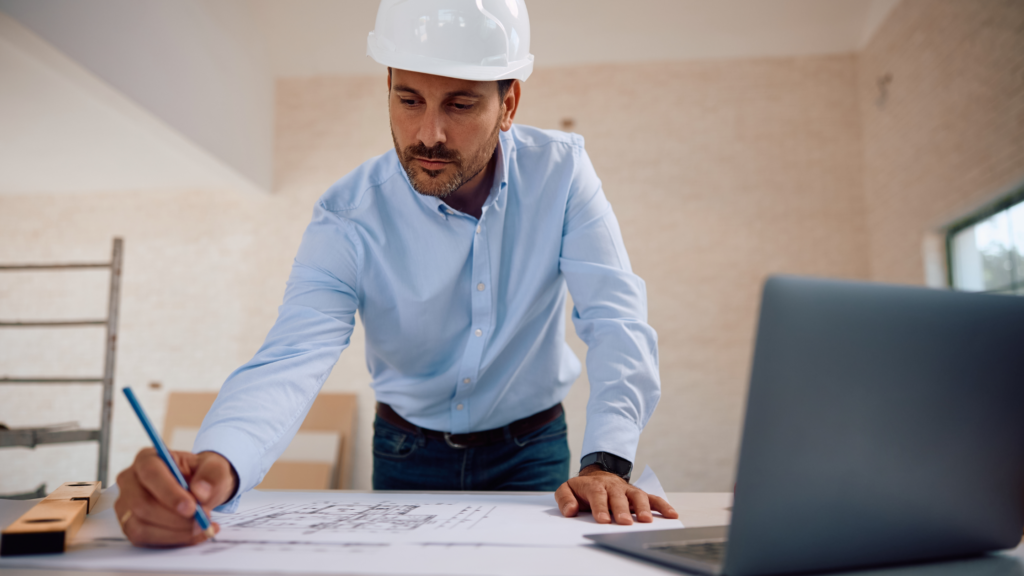 Construction estimator looking at drawings