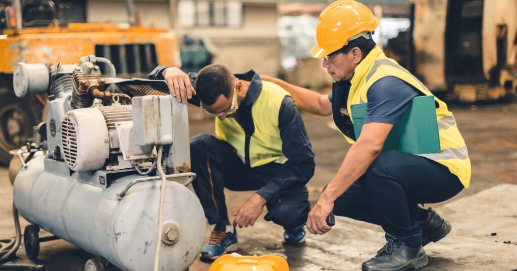 Manager helping a worker on site.