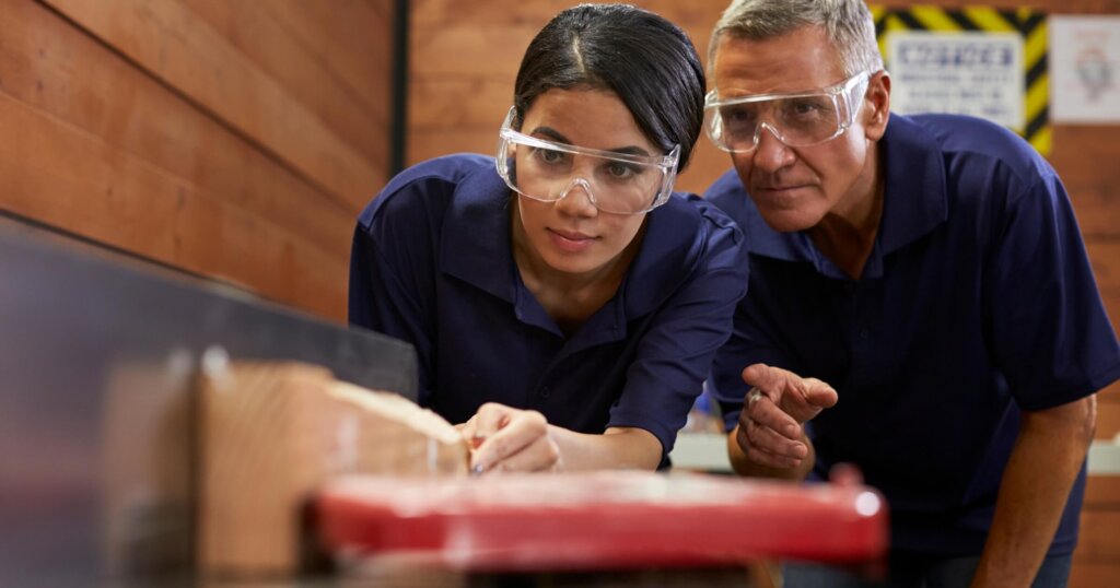 Why Construction Is One of the Biggest Career Opportunities for Women 2 Young women in a carpenter apprenticeship taught by instructor.