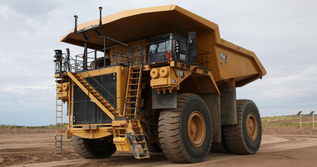 Physical AI is transforming how we build large infrastructure 3 Autonomous Cat® 794 AC mining truck equipped with Cat® MineStar™ Command for hauling.