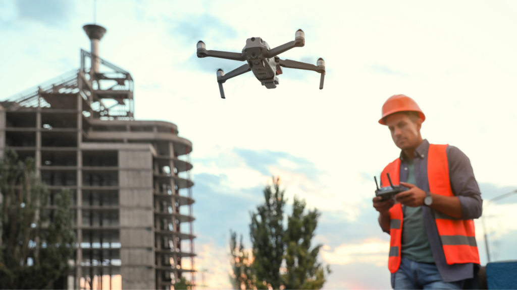 Drone surveyor flying drone on construction site