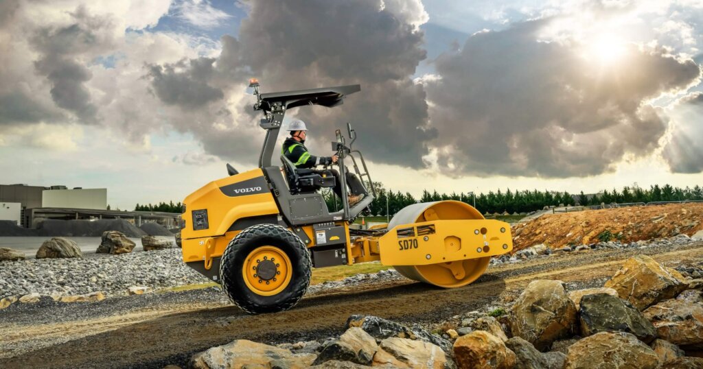 Volvo SD70 soil compactor operating on a jobsite, compacting soil for site preparation.
