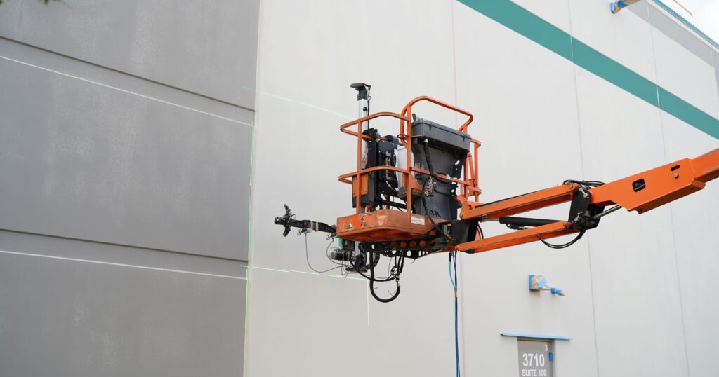 Paintjet Bravo painting robot painting a wall.